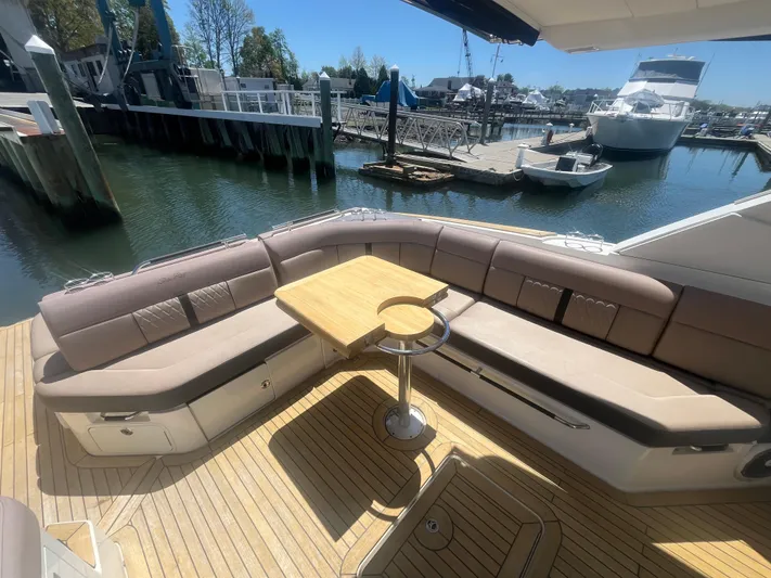 Yacht Photos Pics 2018 Sea Ray SLX 400 yacht with spacious deck seating and wooden table.