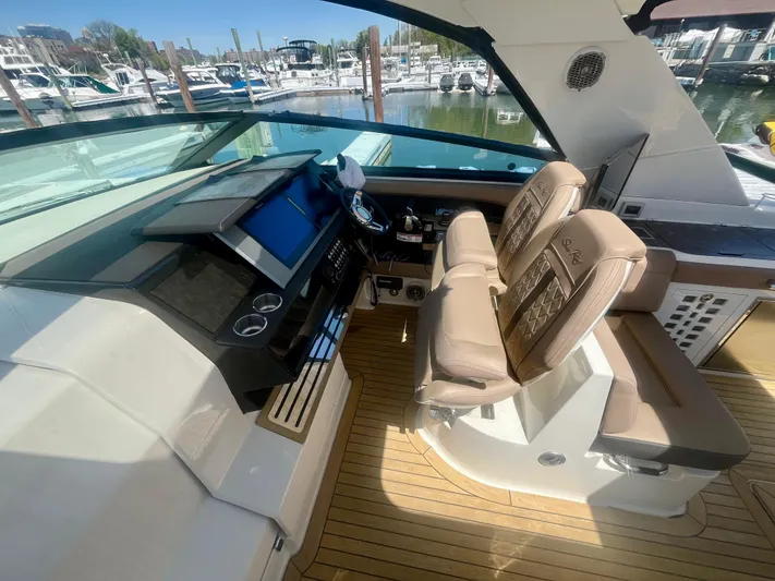  Yacht Photos Pics 2018 Sea Ray SLX 400 helm with dual seats and modern dashboard, docked at marina.