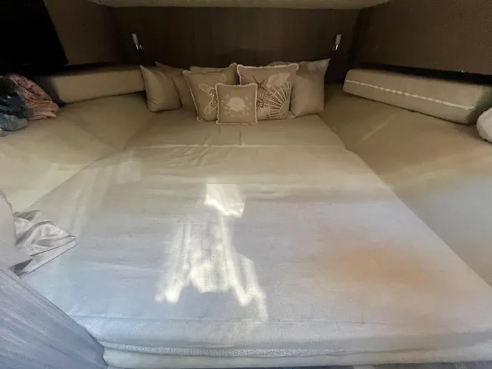  Yacht Photos Pics Luxurious cabin interior of 2018 Sea Ray SLX 400 with plush bedding and cushions.