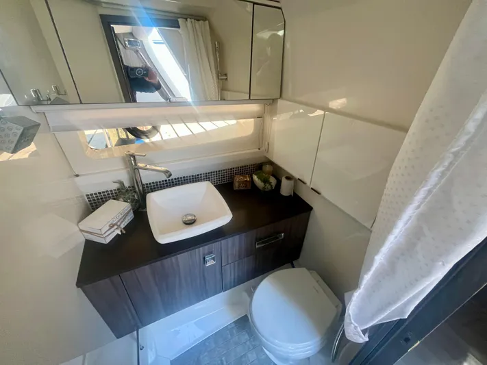  Yacht Photos Pics Luxurious bathroom in 2018 Sea Ray SLX 400 yacht with modern sink and toilet.