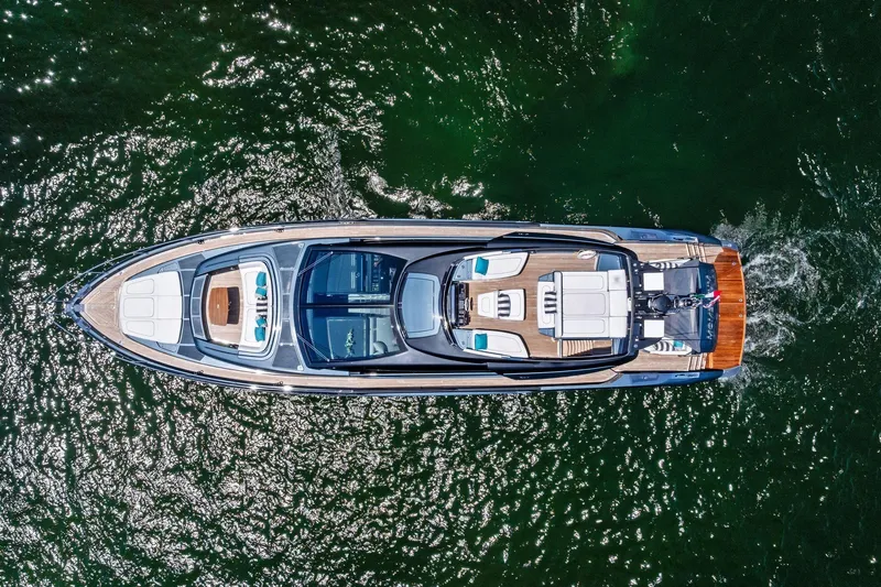Momentum Yacht Photos Pics Aerial view of 2024 Riva 76 PERSEO Super yacht cruising on water.