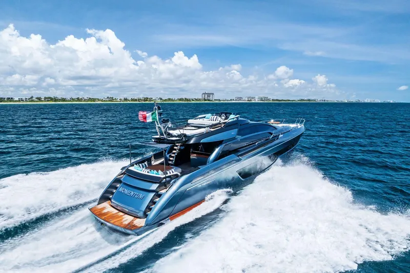 Momentum Yacht Photos Pics 2024 Riva 76 PERSEO Super yacht cruising on open sea under clear skies.