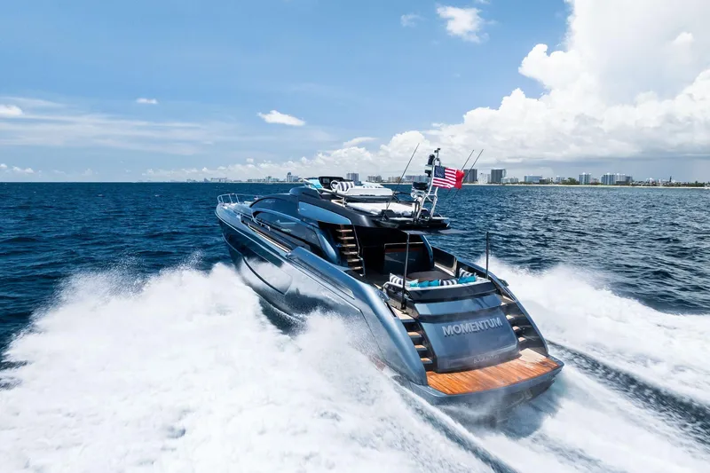 Momentum Yacht Photos Pics 2024 Riva 76 PERSEO Super yacht cruising on open sea under clear skies.
