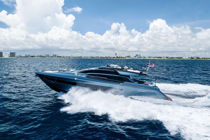 Momentum Yacht Photos Pics 2024 Riva 76 PERSEO Super yacht cruising on open water under a clear sky.
