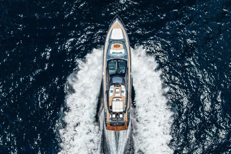 Momentum Yacht Photos Pics Aerial view of 2024 Riva 76 PERSEO Super yacht cruising on open water.