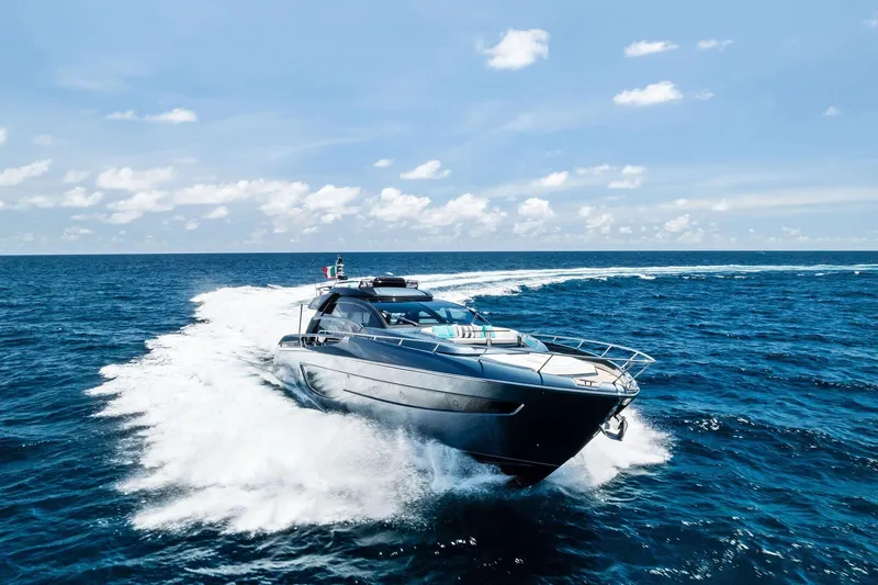 Momentum Yacht Photos Pics 2024 Riva 76 PERSEO Super yacht cruising on open sea under clear skies.