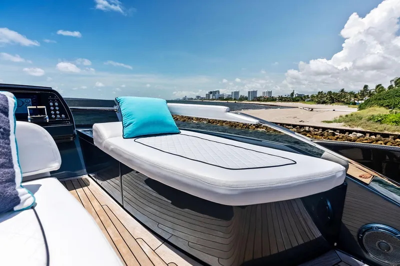 Momentum Yacht Photos Pics Luxurious 2024 Riva 76 PERSEO Super yacht with sunbed, ocean view, and modern design.