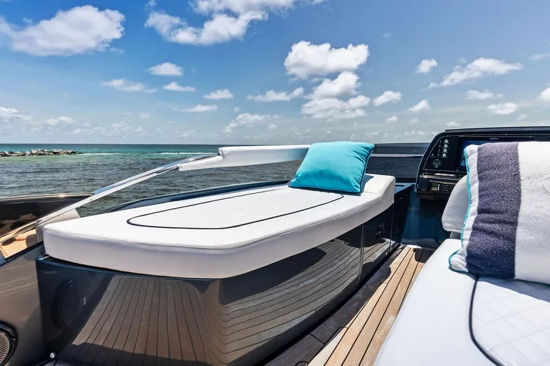 Momentum Yacht Photos Pics Luxurious 2024 Riva 76 PERSEO Super yacht deck with plush seating and ocean view.