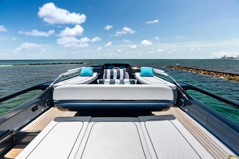 Momentum Yacht Photos Pics Luxurious 2024 Riva 76 PERSEO Super yacht deck with ocean view and plush seating.