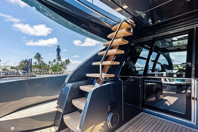 Momentum Yacht Photos Pics Luxurious 2024 Riva 76 PERSEO Super yacht with sleek design and wooden staircase.