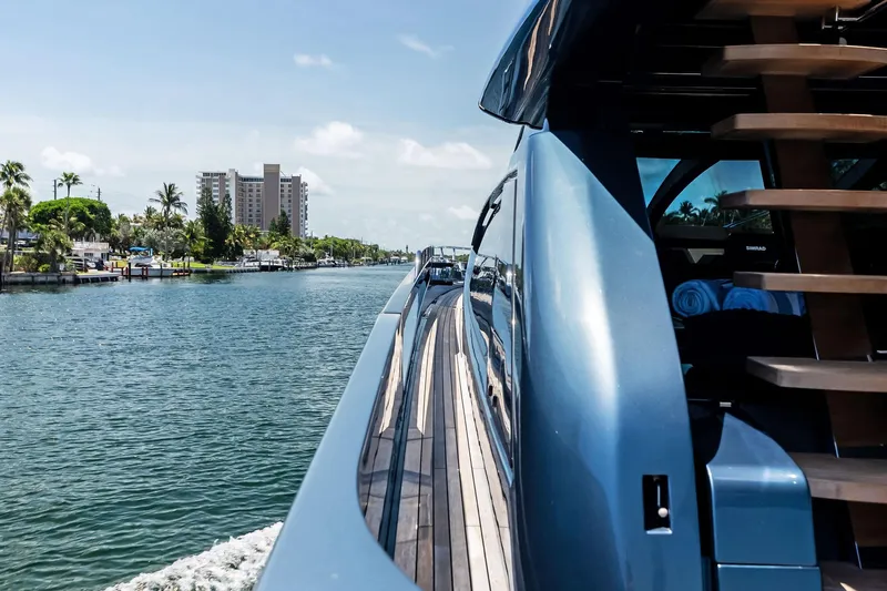 Momentum Yacht Photos Pics 2024 Riva 76 PERSEO Super yacht cruising on a scenic waterway.