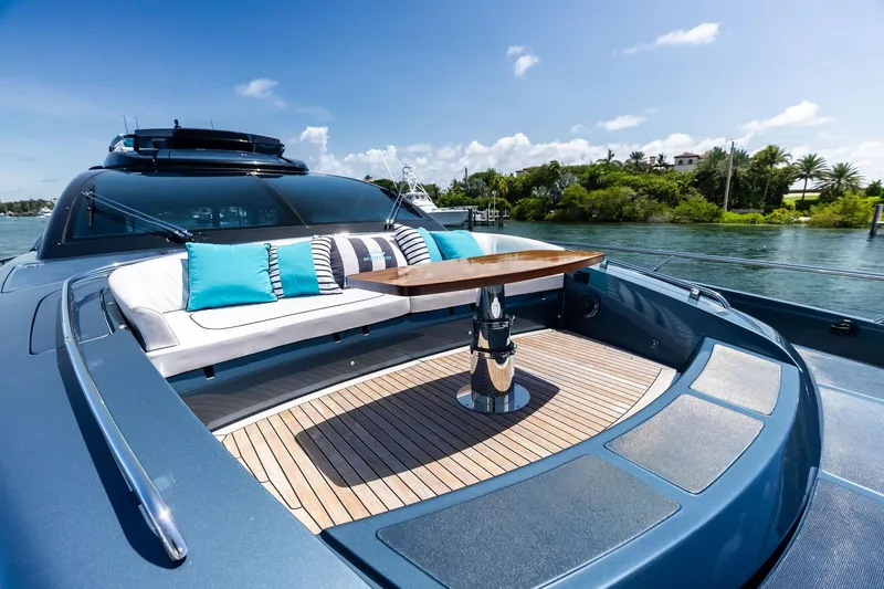 Momentum Yacht Photos Pics Luxurious 2024 Riva 76 PERSEO Super yacht deck with elegant seating and scenic water view.