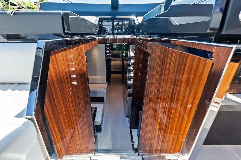 Momentum Yacht Photos Pics Luxurious interior of 2024 Riva 76 PERSEO Super yacht with sleek wooden finishes.