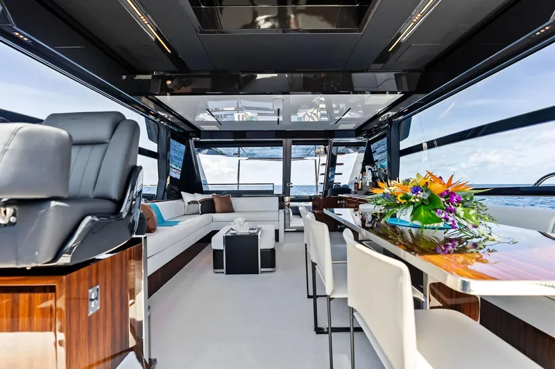 Momentum Yacht Photos Pics Luxurious interior of 2024 Riva 76 PERSEO Super yacht with elegant seating and floral arrangement.