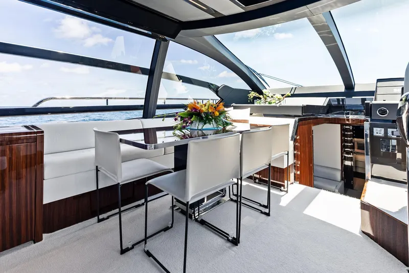 Momentum Yacht Photos Pics Luxurious interior of 2024 Riva 76 PERSEO Super yacht with elegant dining area.