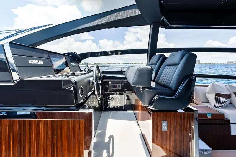 Momentum Yacht Photos Pics Luxurious helm of 2024 Riva 76 PERSEO Super yacht with modern controls and seating.