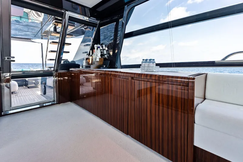 Momentum Yacht Photos Pics Luxurious interior of 2024 Riva 76 PERSEO Super yacht with elegant wood finish and ocean view.