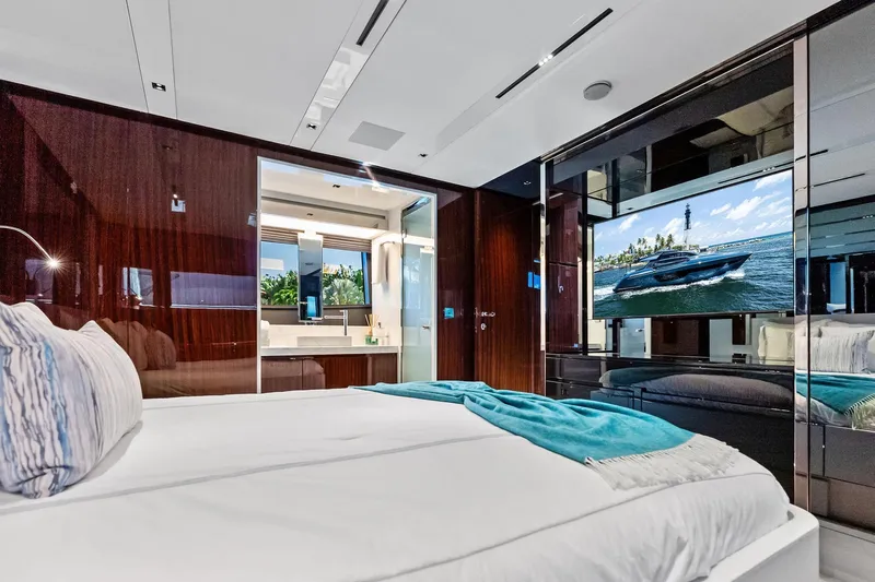 Momentum Yacht Photos Pics Luxurious bedroom interior of 2024 Riva 76 PERSEO Super yacht with modern amenities.