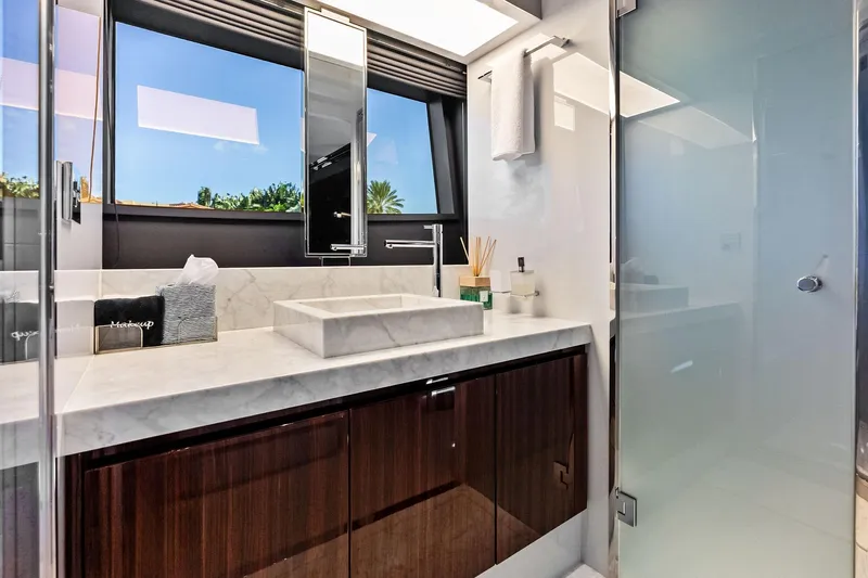 Momentum Yacht Photos Pics Luxurious bathroom interior on 2024 Riva 76 PERSEO Super yacht, featuring marble sink and modern fixtures.
