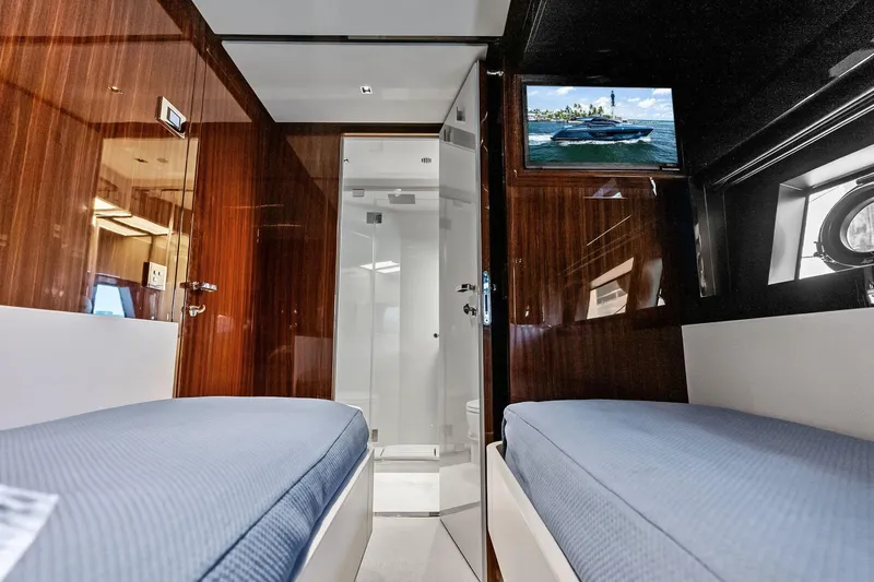 Momentum Yacht Photos Pics Luxurious interior of 2024 Riva 76 PERSEO Super yacht with twin beds and TV.