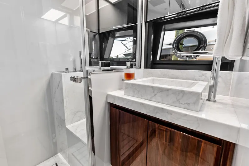 Momentum Yacht Photos Pics Luxurious bathroom in 2024 Riva 76 PERSEO Super yacht with marble sink and modern fixtures.