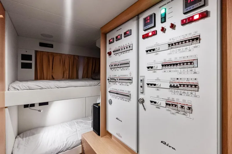 Momentum Yacht Photos Pics Interior of 2024 Riva 76 PERSEO Super yacht with control panels and bunk beds.
