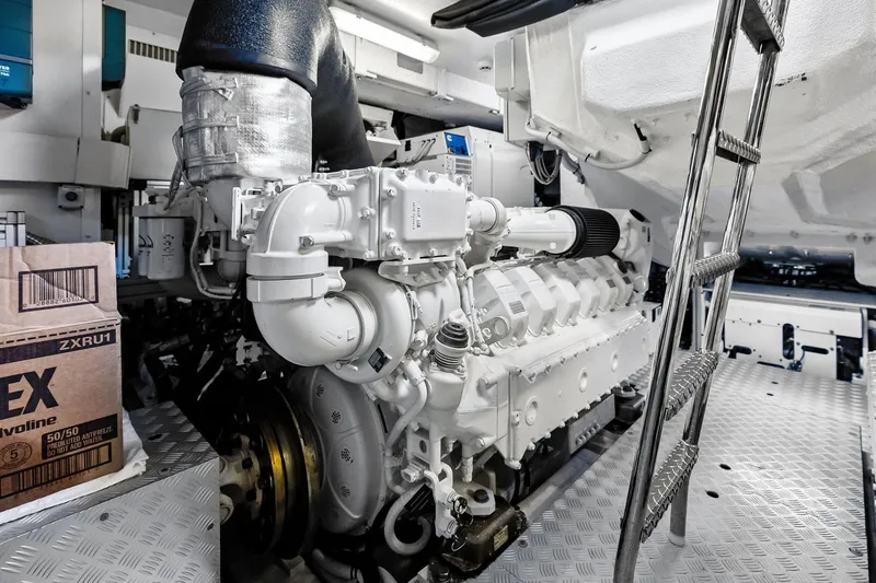 Momentum Yacht Photos Pics Engine room of 2024 Riva 76 PERSEO Super yacht, featuring a powerful engine and metallic ladder.