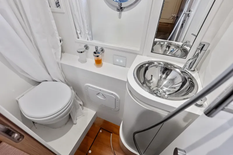Momentum Yacht Photos Pics Luxurious bathroom in 2024 Riva 76 PERSEO Super yacht with modern fixtures and elegant design.