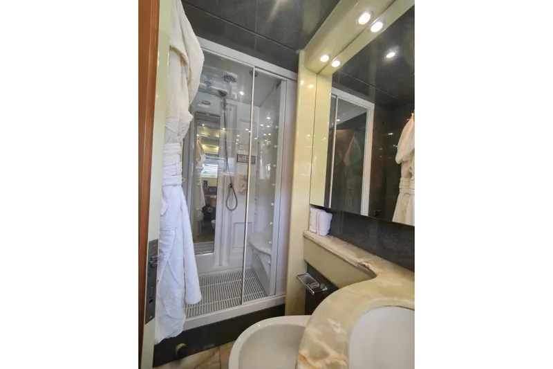 Lady A Yacht Photos Pics Luxurious bathroom in 2000 Maiora 29 DP yacht with modern shower and elegant sink.