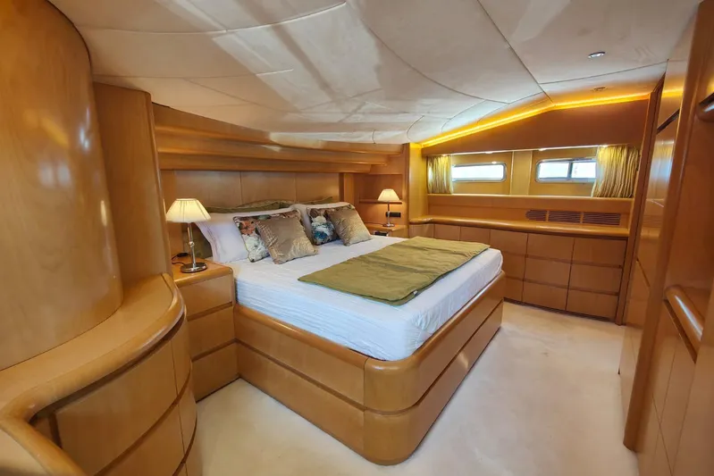 Lady A Yacht Photos Pics Luxurious bedroom interior of 2000 Maiora 29 DP yacht with elegant wood finish.