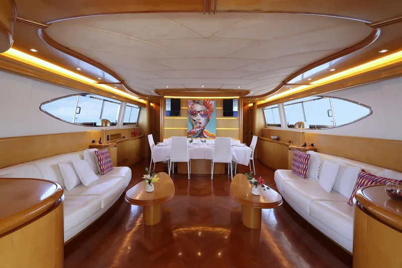 Lady A Yacht Photos Pics Luxurious interior of 2000 Maiora 29 DP yacht with elegant seating and dining area.