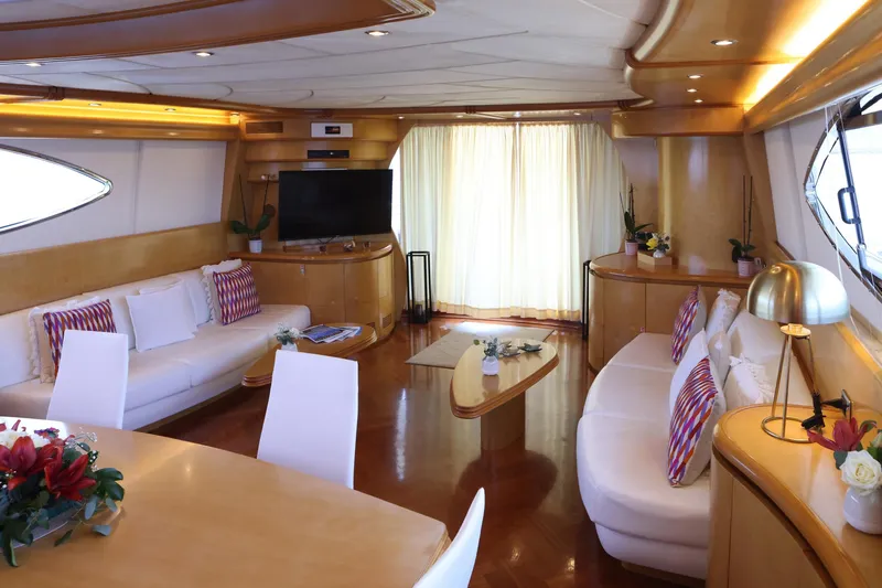 Lady A Yacht Photos Pics Luxurious interior of 2000 Maiora 29 DP yacht with elegant seating and decor.