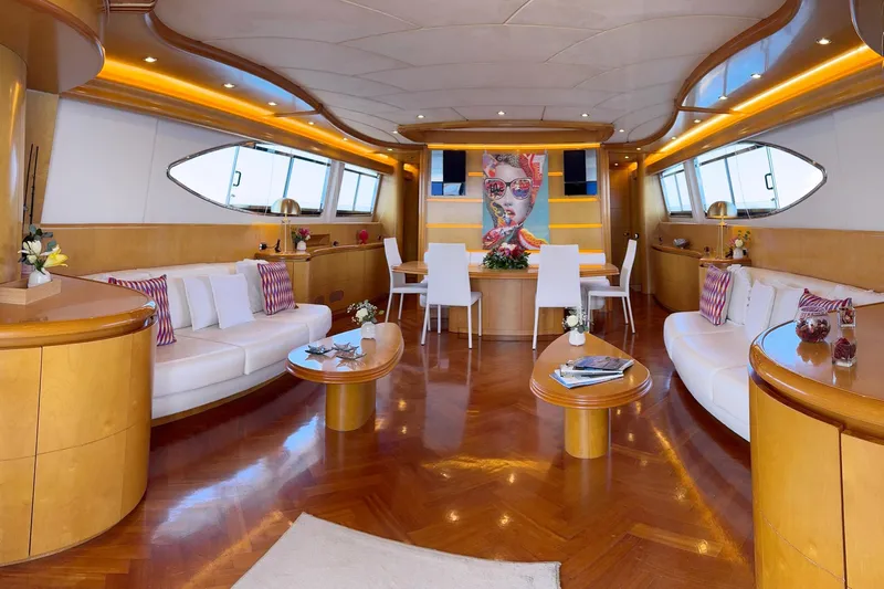 Lady A Yacht Photos Pics Luxurious interior of 2000 Maiora 29 DP yacht with elegant seating and modern decor.