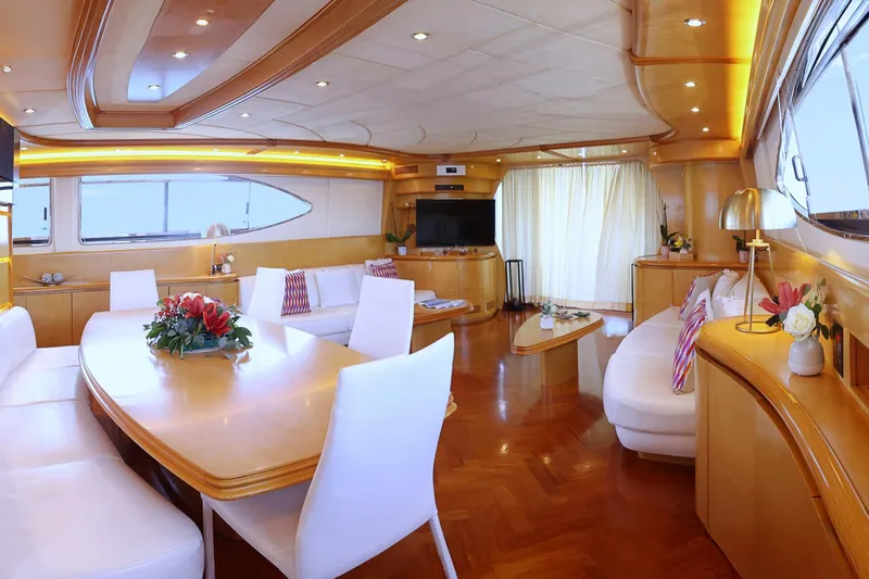Lady A Yacht Photos Pics Luxurious interior of 2000 Maiora 29 DP yacht with elegant wood finishes and modern decor.