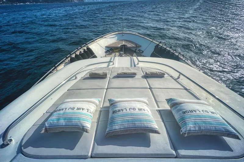 Lady A Yacht Photos Pics Luxurious Maiora 29 DP yacht deck with cushions, cruising on open sea, 2000 model.
