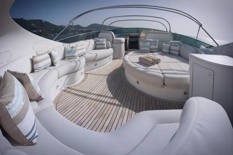 Lady A Yacht Photos Pics Luxurious deck of 2000 Maiora 29 DP yacht with elegant seating and scenic views.