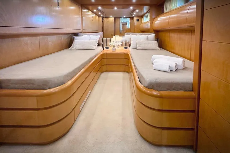 Lady A Yacht Photos Pics Luxurious twin cabin interior of 2000 Maiora 29 DP yacht with elegant wood finish.
