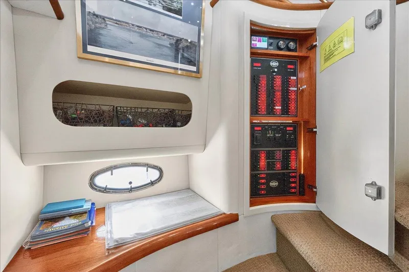 Vortex Yacht Photos Pics 2004 Neptunus 56 Flybridge yacht interior with electrical panel and porthole.