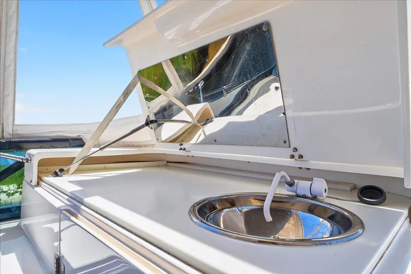 Vortex Yacht Photos Pics 2004 Neptunus 56 Flybridge yacht sink area with mirror and faucet.