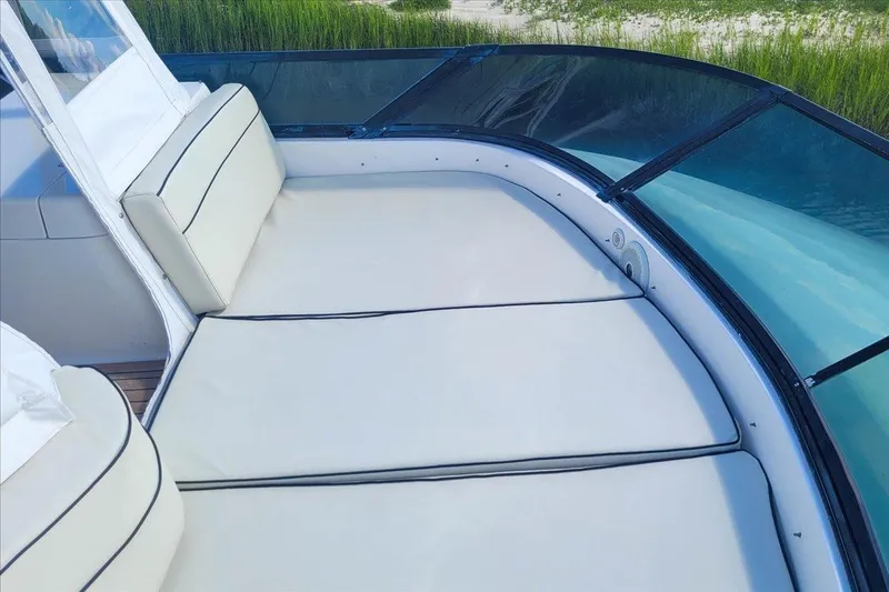 Vortex Yacht Photos Pics Luxurious seating area on 2004 Neptunus 56 Flybridge yacht with scenic water view.