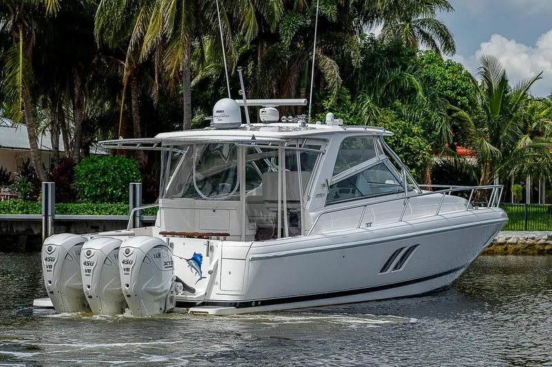 Annie Yacht Photos Pics 2014 Intrepid 475 Sport Yacht with triple outboard engines on a scenic waterway.