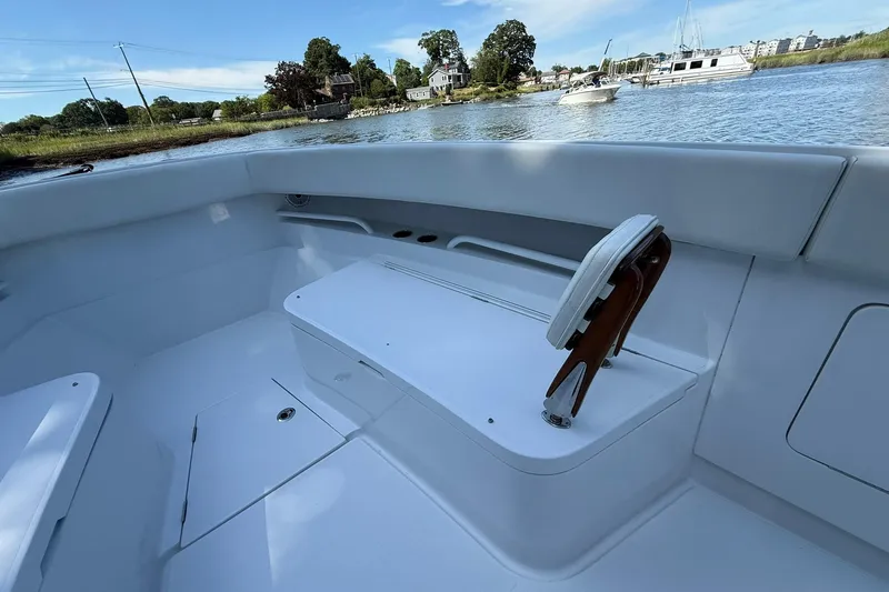  Yacht Photos Pics 2021 Jupiter 38 HFS boat interior with seating, on a calm waterway.