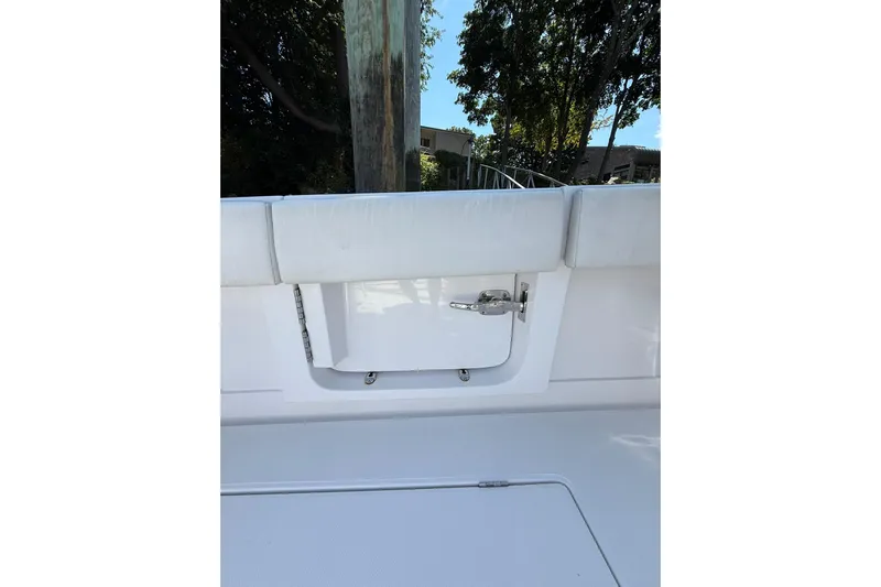  Yacht Photos Pics 2021 Jupiter 38 HFS boat interior, featuring a sleek white design and cushioned seating.