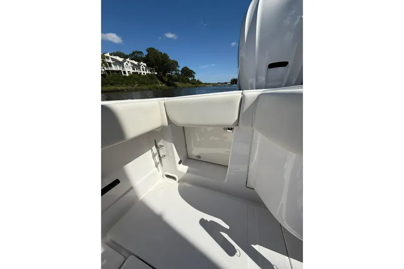  Yacht Photos Pics 2021 Jupiter 38 HFS boat interior with white seating, near waterfront homes.