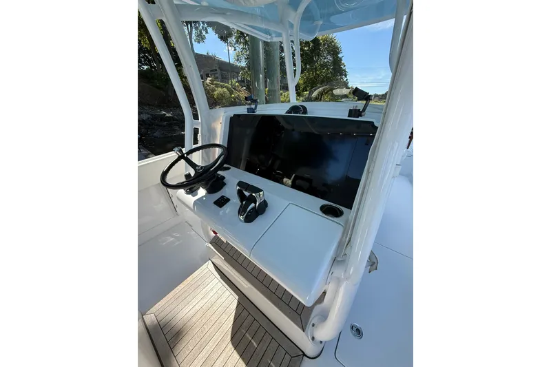  Yacht Photos Pics 2021 Jupiter 38 HFS boat helm with steering wheel and control panel.