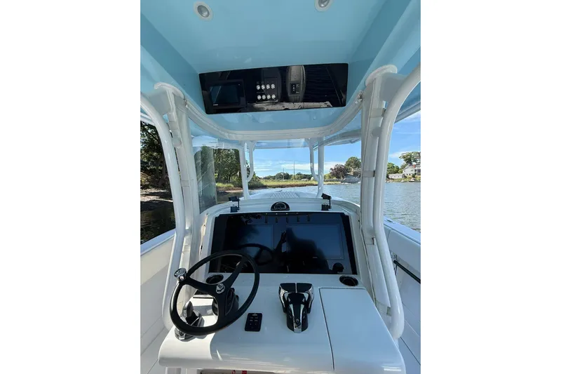  Yacht Photos Pics 2021 Jupiter 38 HFS boat helm with steering wheel and control panel.
