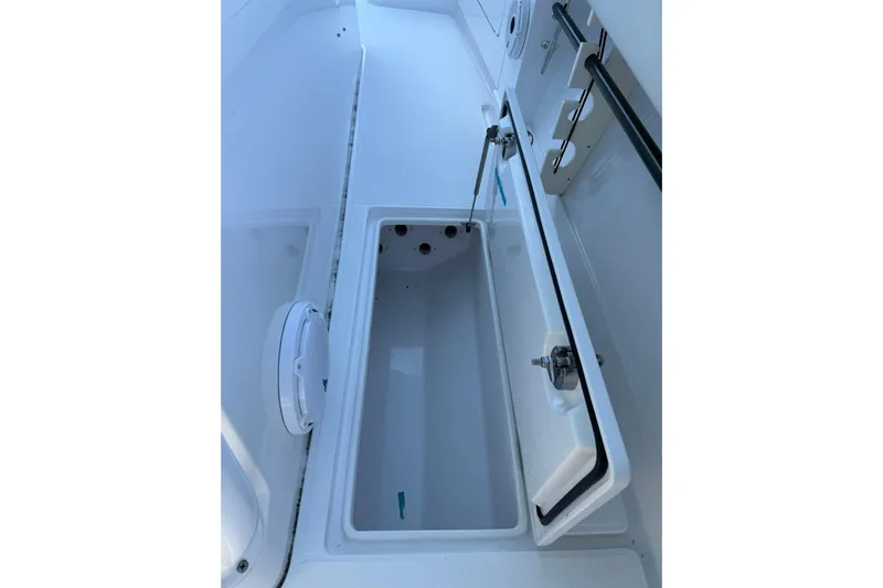 Yacht Photos Pics Open storage compartment on a 2021 Jupiter 38 HFS boat, showcasing interior space.
