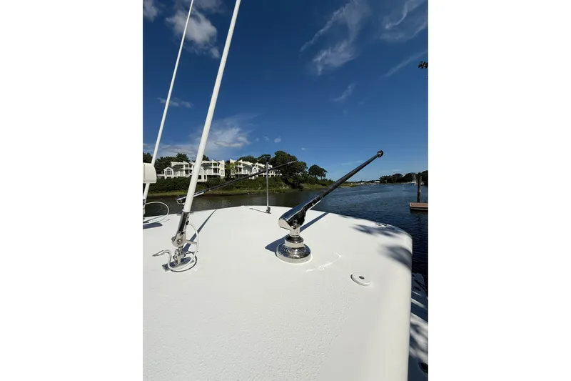  Yacht Photos Pics 2021 Jupiter 38 HFS boat deck with clear blue sky and waterfront view.