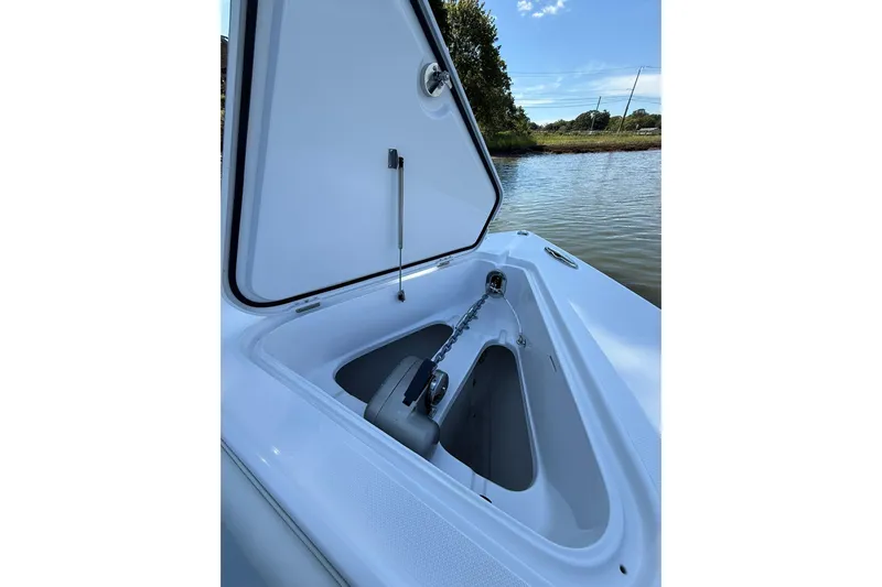  Yacht Photos Pics Open anchor compartment on 2021 Jupiter 38 HFS boat by the water.