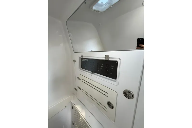  Yacht Photos Pics Interior view of 2021 Jupiter 38 HFS boat control panel and storage compartments.